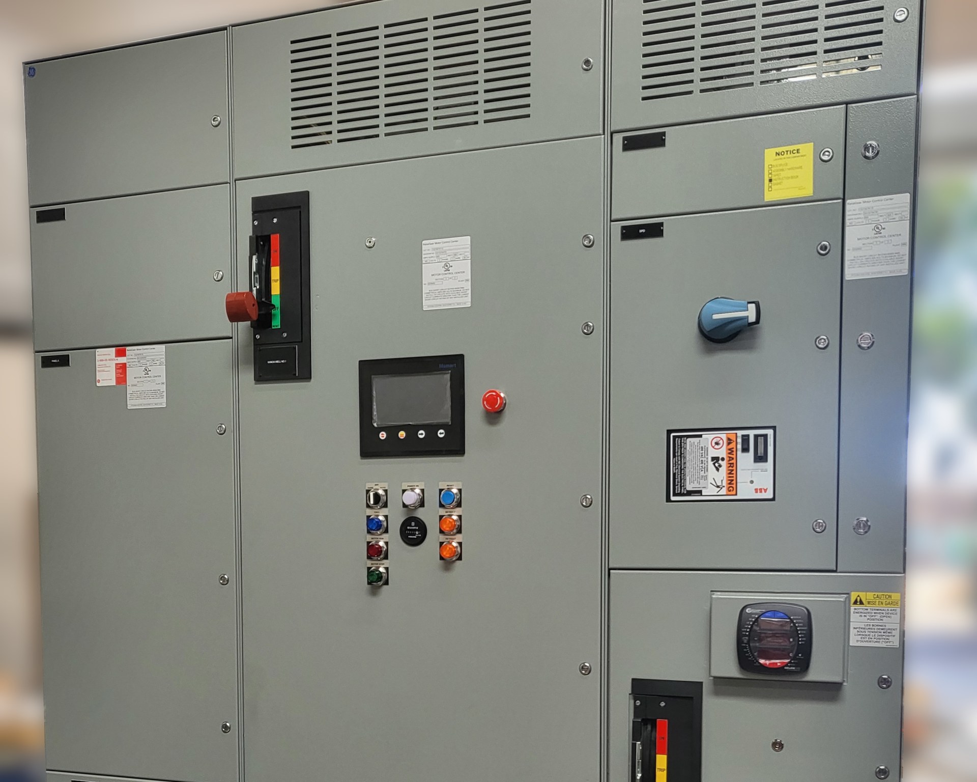 A multi-section motor control lineup with an operator panel and pilot lights